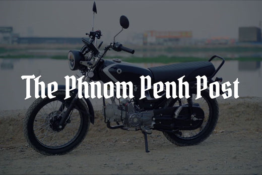 The Phnom Penh Post logo displayed in front of an Ori Calypso motorcycle